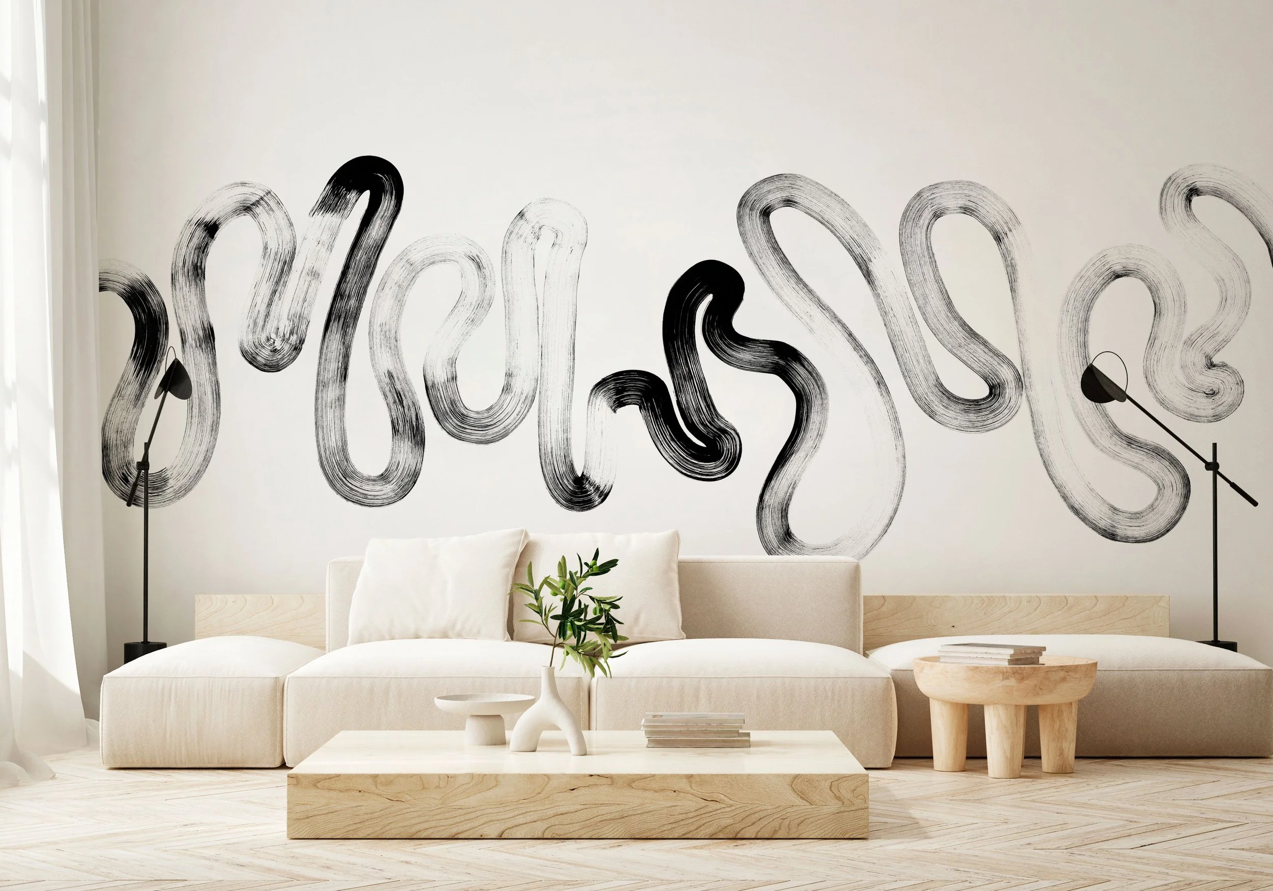 Black and white abstract brushstroke mural in minimalist living room with natural wood furniture