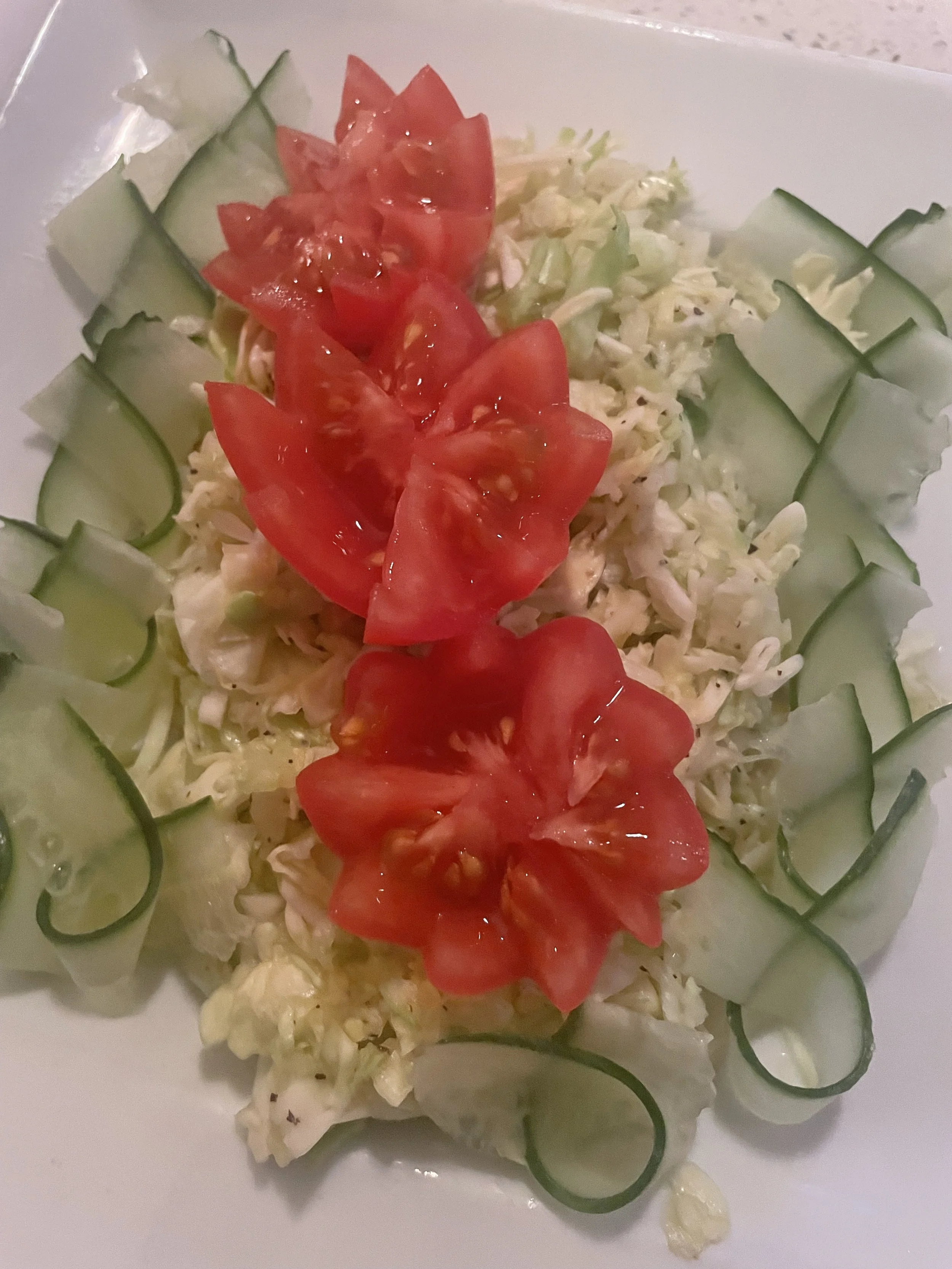 Cucumber, cabbage, and tomato salad