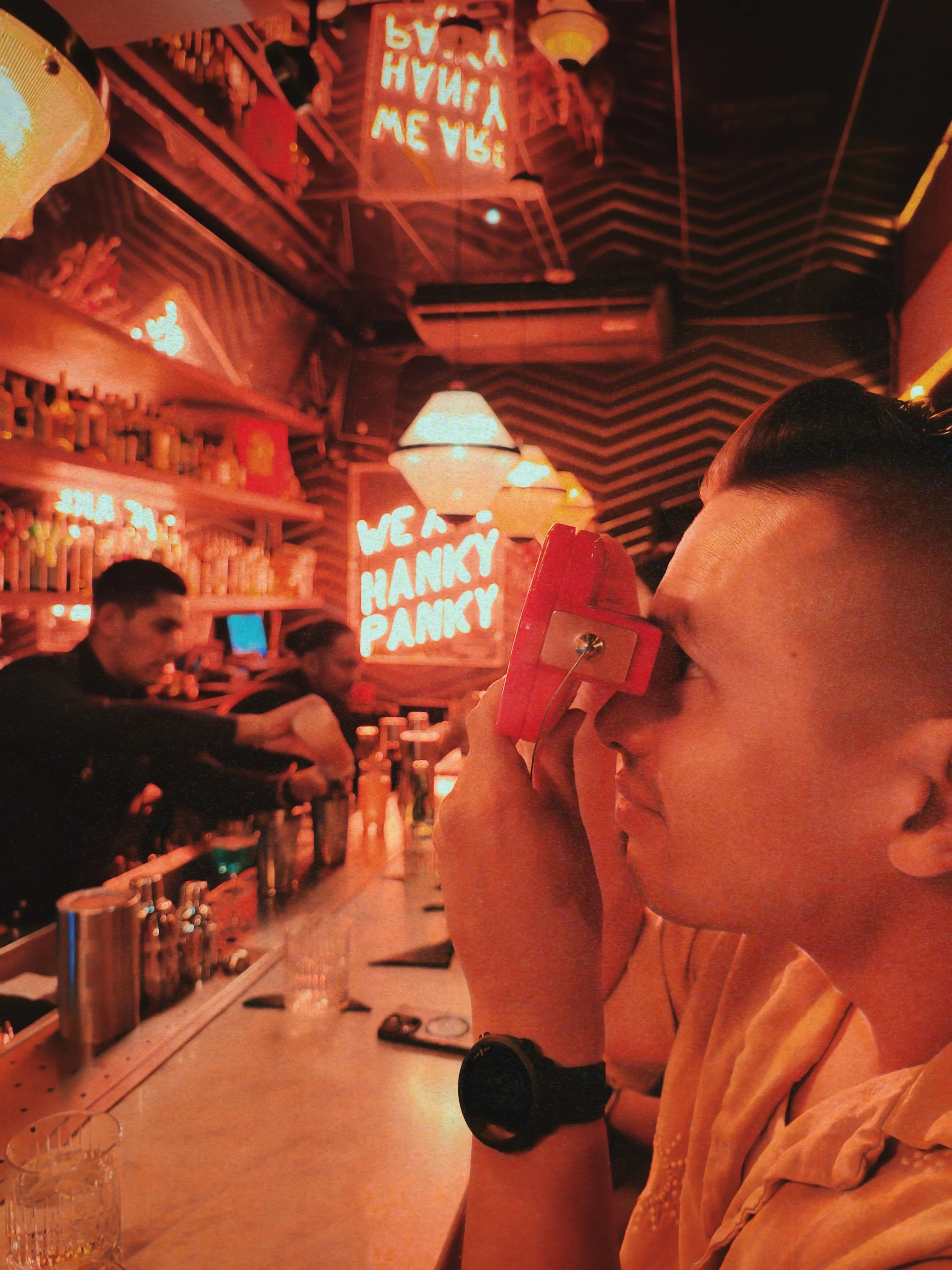 I'm sitting by the bar in Mexico City, enjoying a hand-made cocktail.