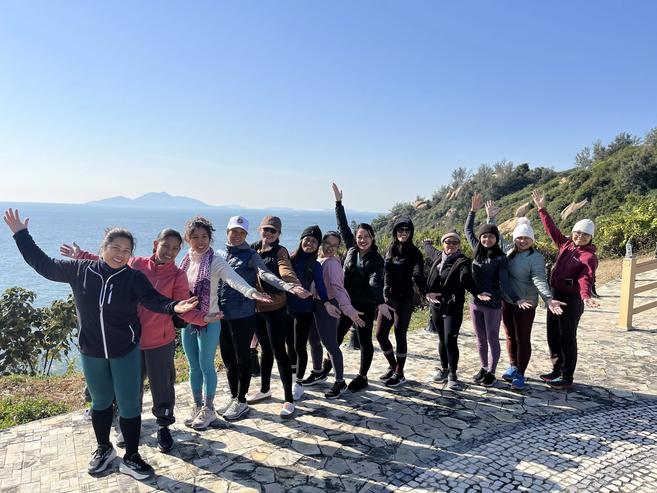 Women in Nature together outdoors by the ocean