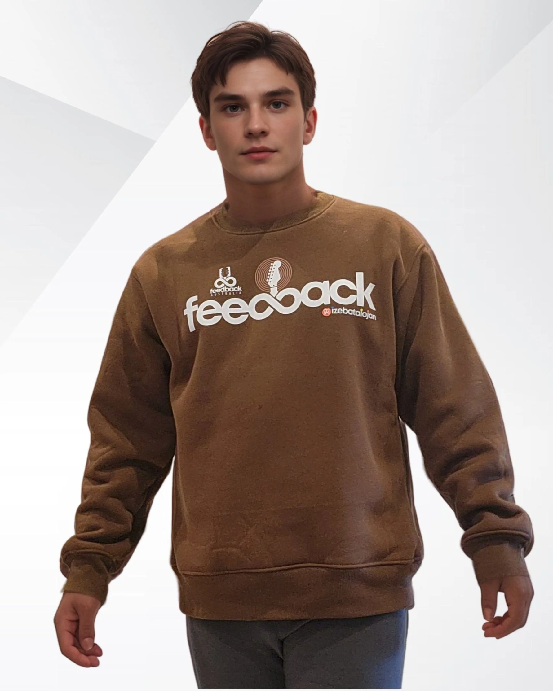 Young man wearing a brown sweatshirt with white and red logos and text, standing against a light background.