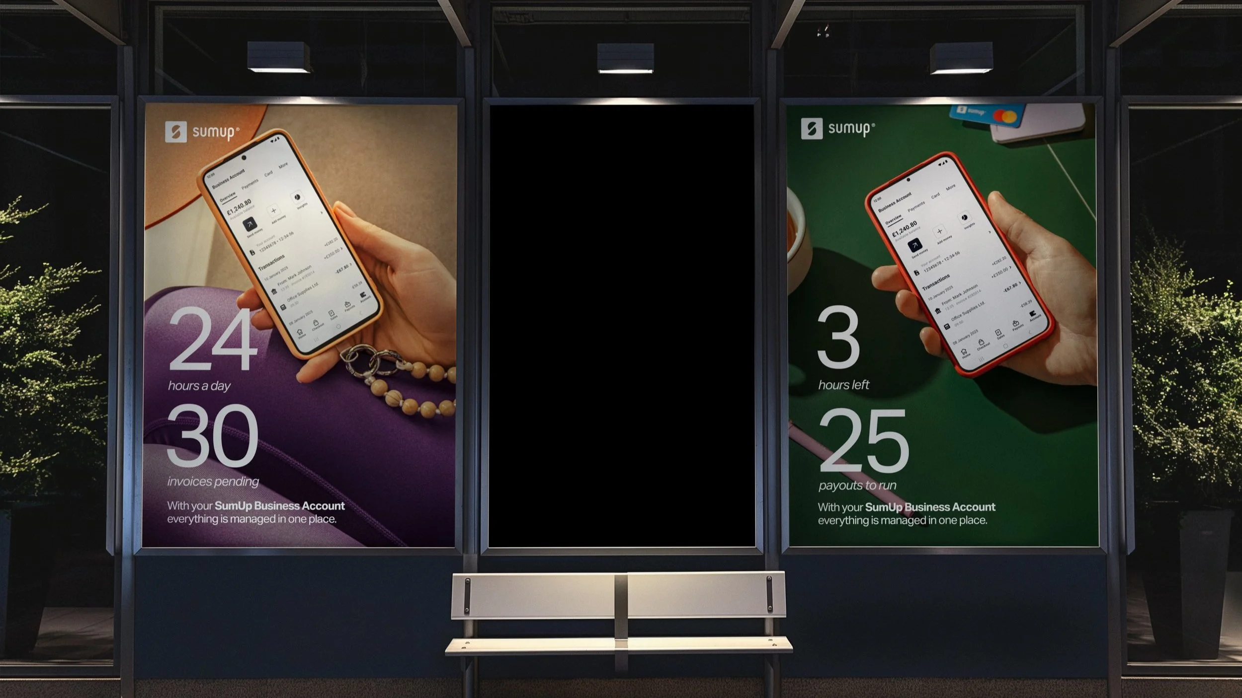 Street advertisement display with two posters showing smartphones and financial information, connected to a bench.
