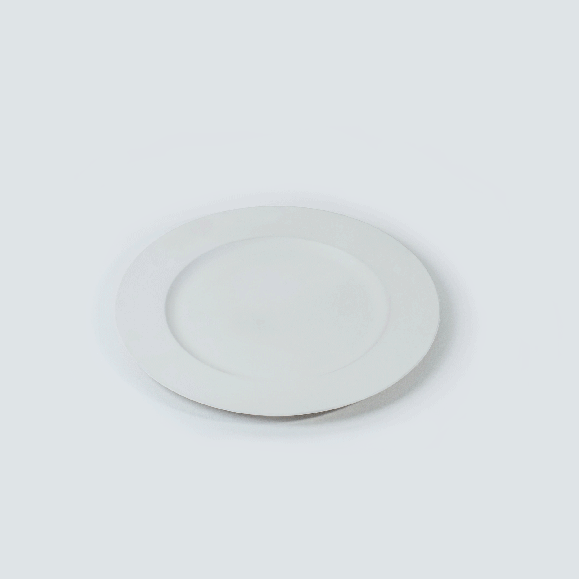 White empty plate on a white background.