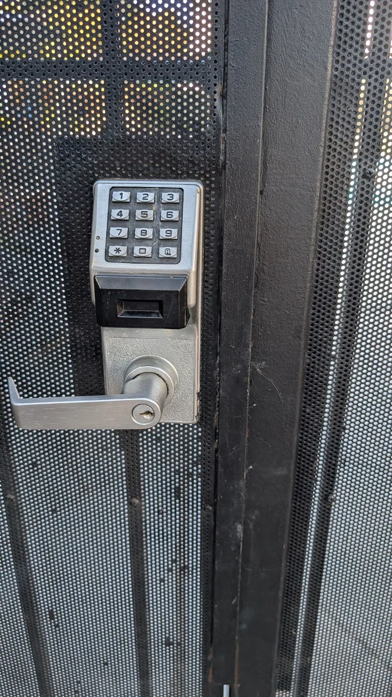 The original standalone keypad lock on the pool gate