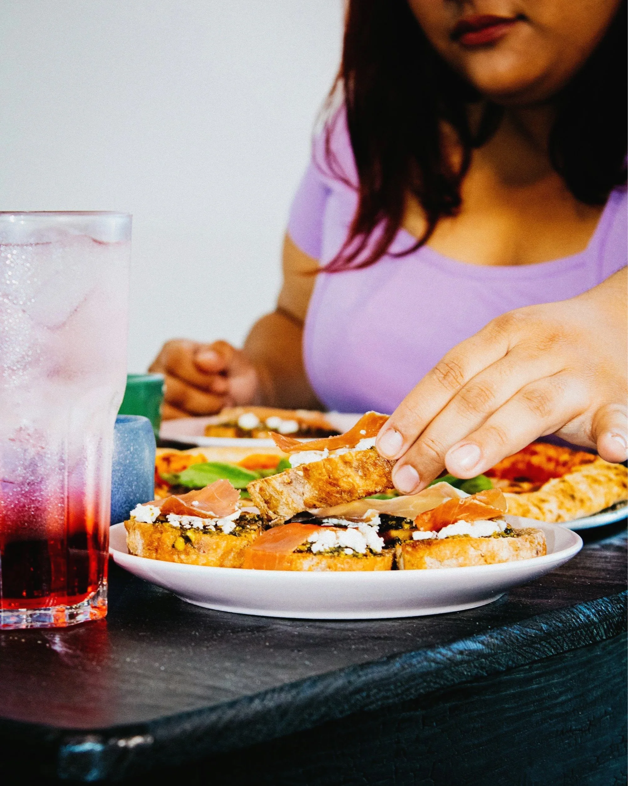 a heavier woman eating a healthy meal