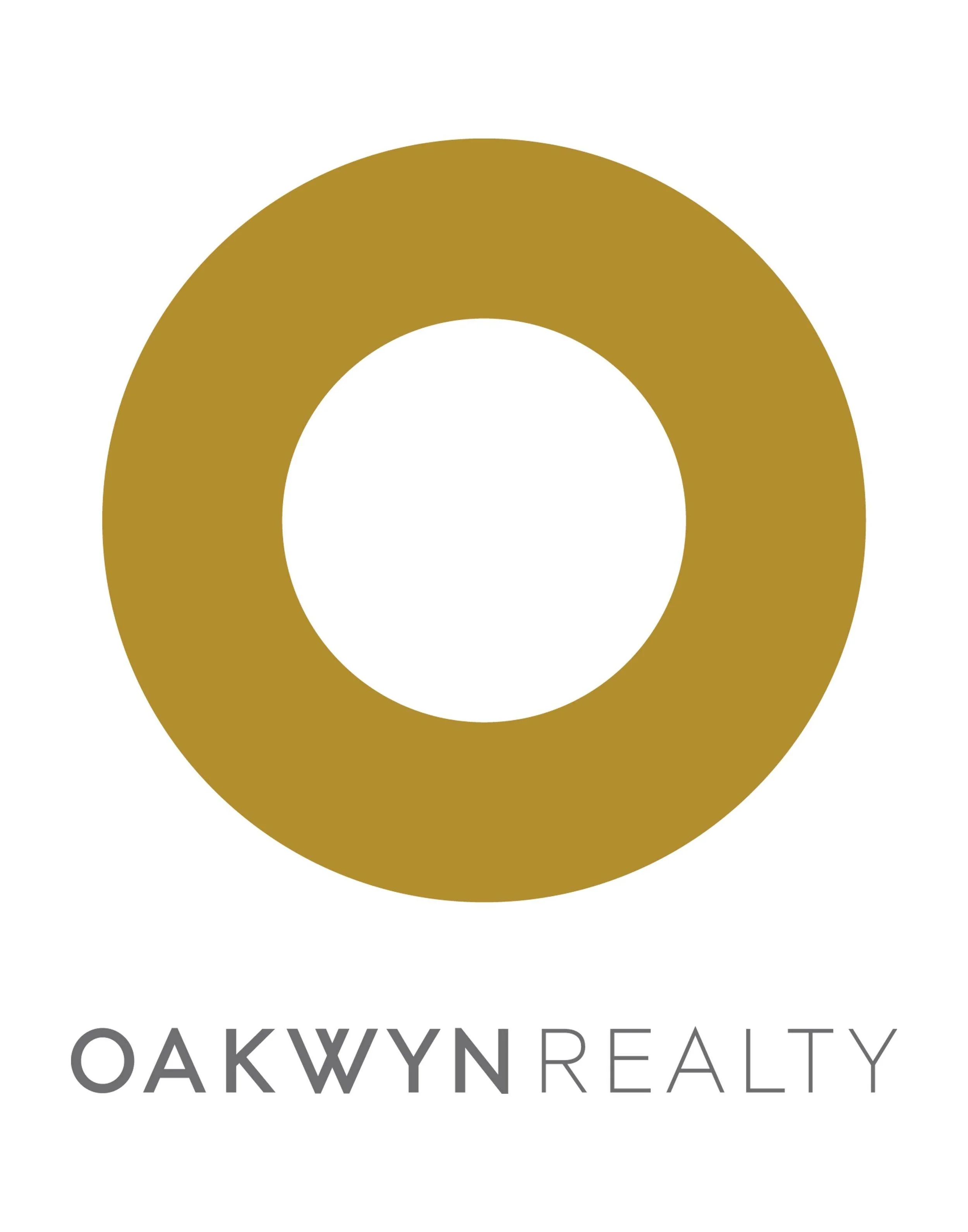 Logo of Oakwyn Realty featuring a gold ring and the company name below.