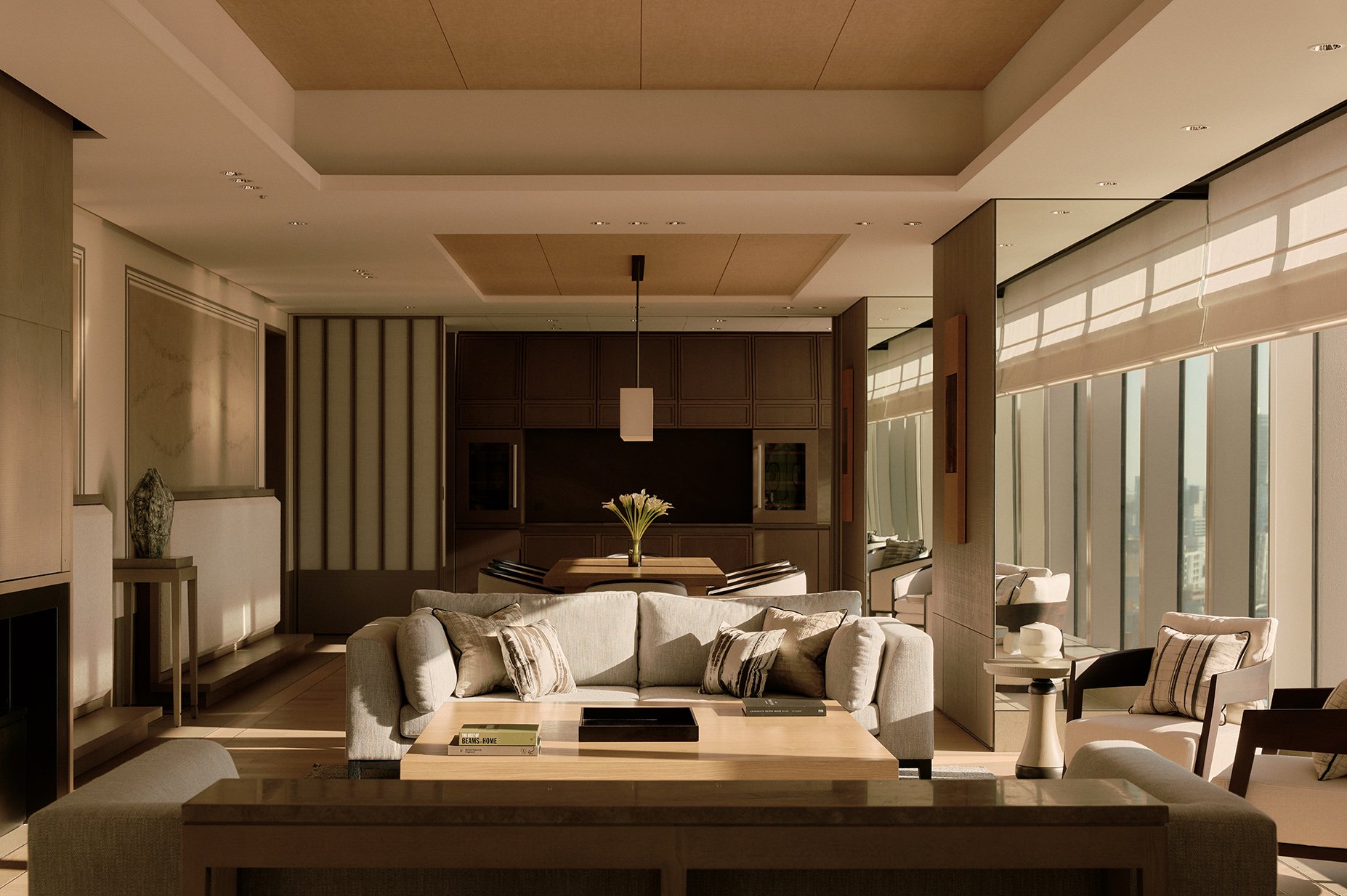 Luxurious living room with beige sofas, wooden coffee table, large windows with shades, and decorative items