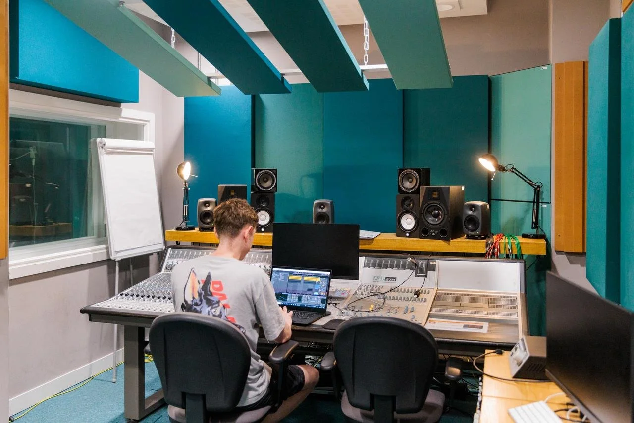 Sound studio with a man working at the desk