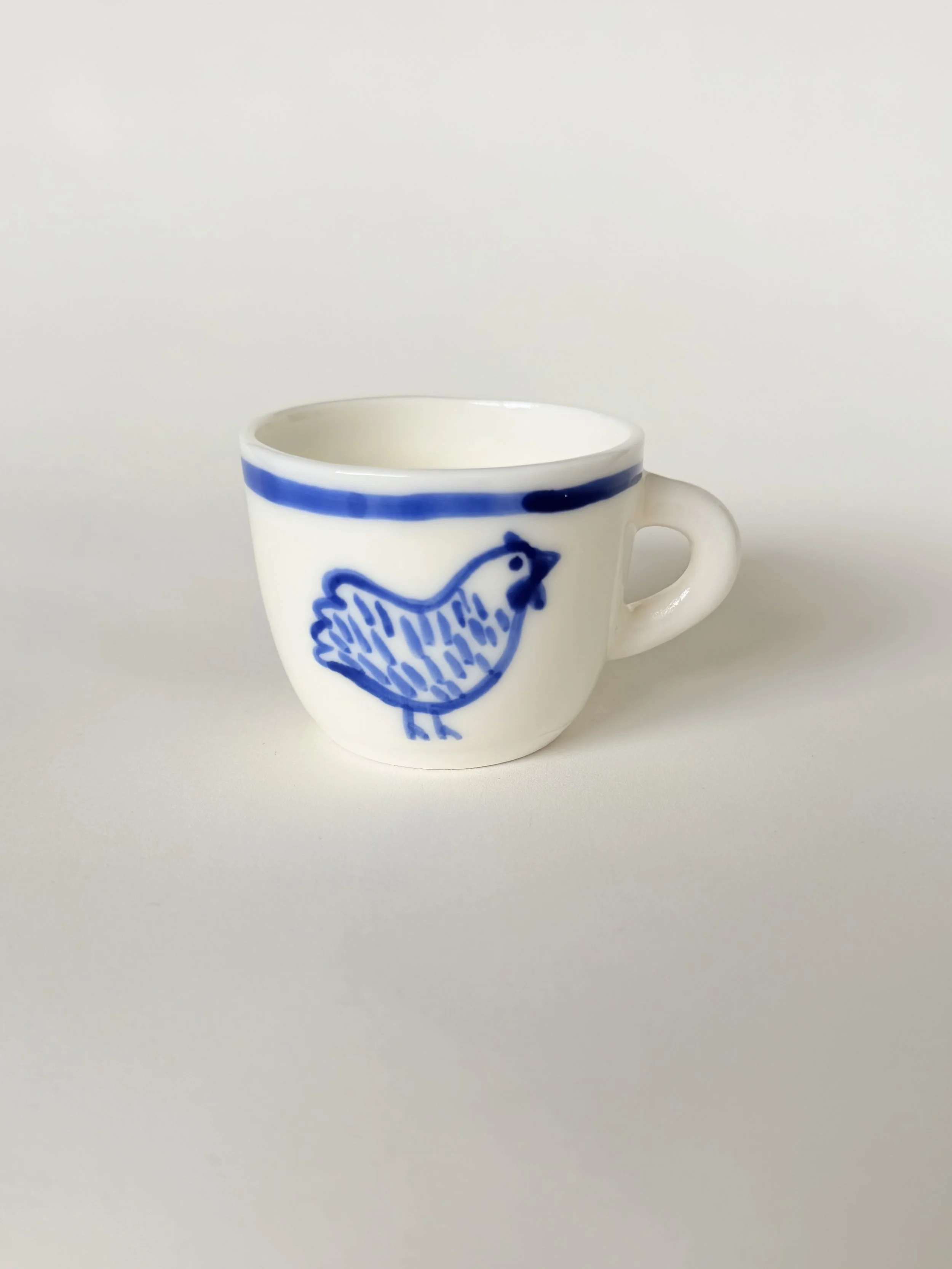 Espresso cup with chicken