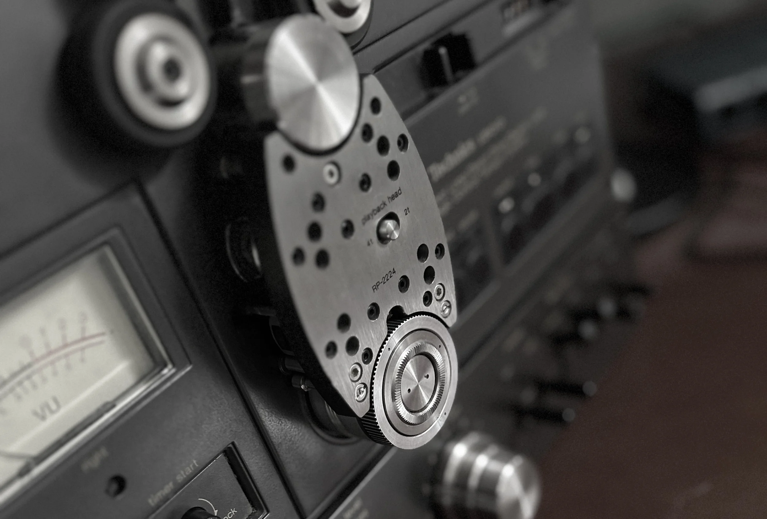 Desaturated close-up of tape recorder
