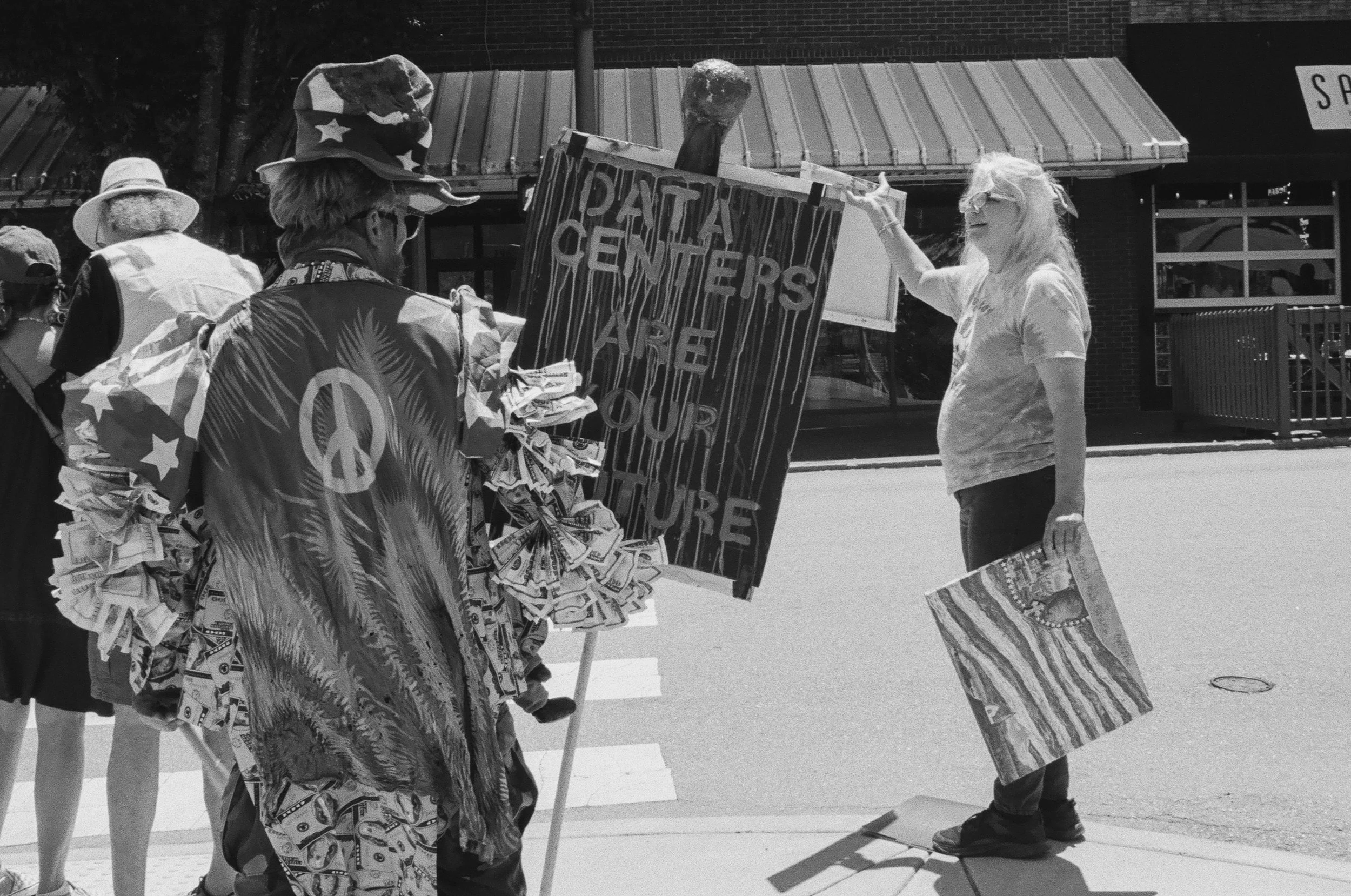    Waynesville, NC - June 13th, 2026.    A resident puts on a theatrical protest against data centers.  