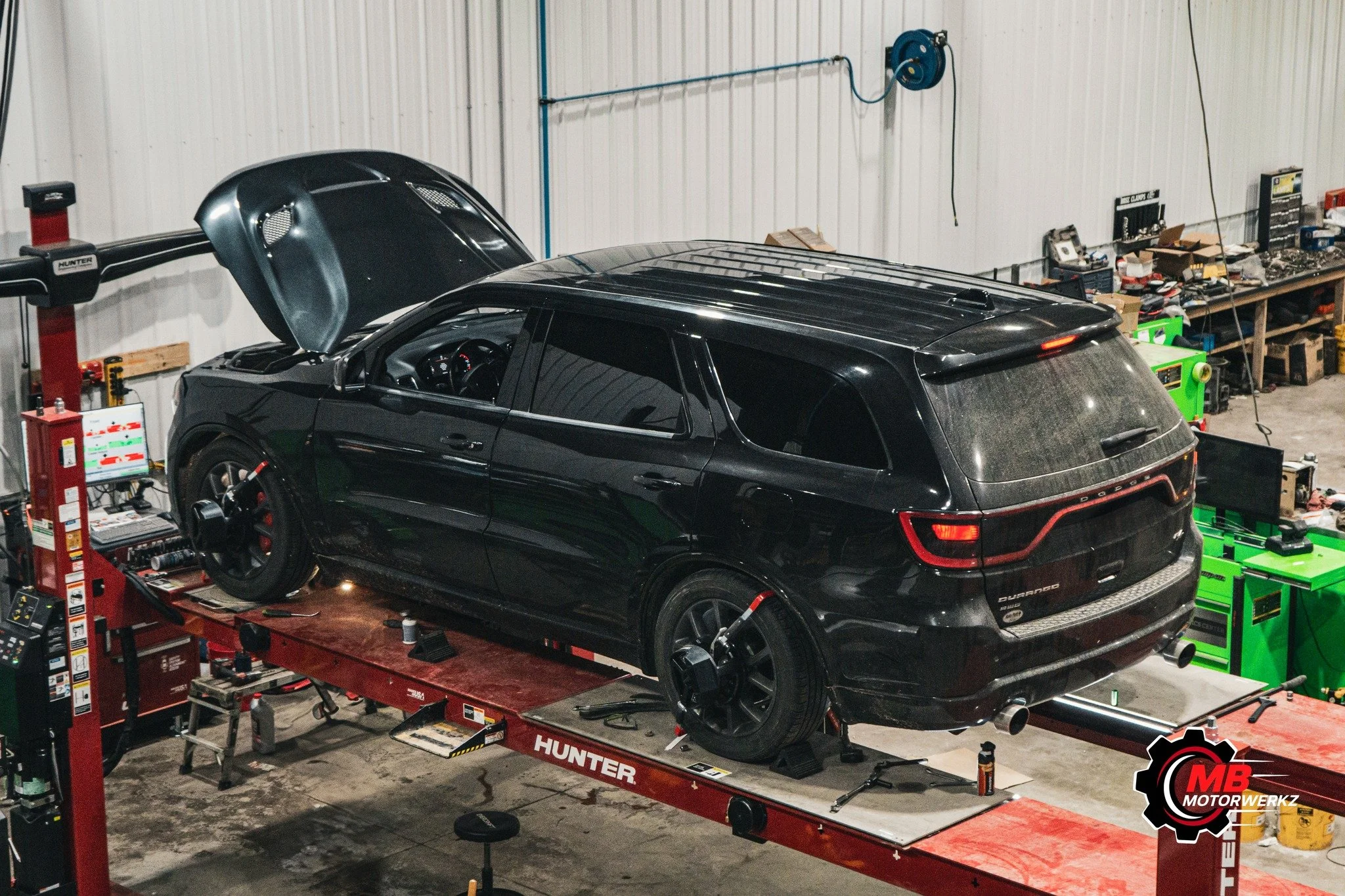 This 2016 Dodge Durango R/T with a 5.7L HEMI came in for suspension work and cooling system repairs. We installed a Godspeed camber kit with rear upper control arms, added a front camber kit, replaced the rear upper links, handled seized hardware, an