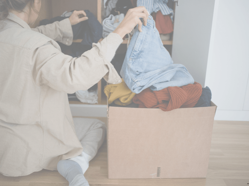 woman decluttering closet