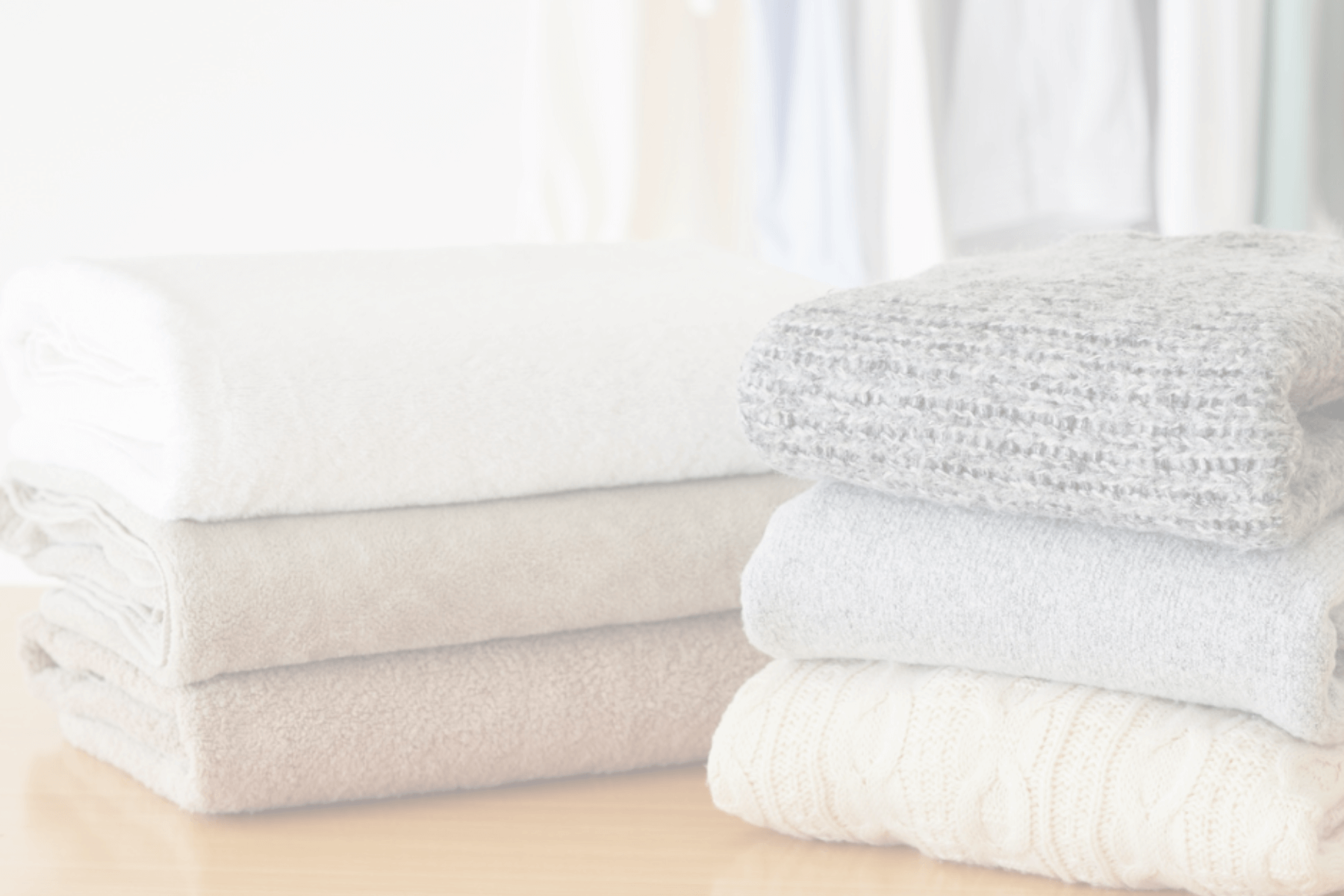 professional organizer towels and sweater stacks