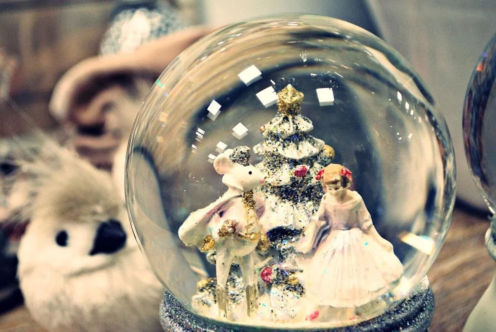 snowglobe of young girl, christmas tree and the Rat King