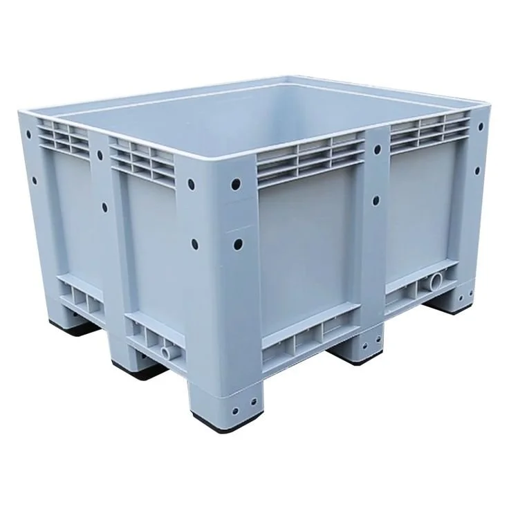 A large plastic grey storage or shipping crate with ventilation slats and black rubber feet.