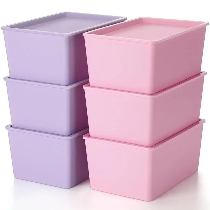 Six plastic storage bins, three purple and three pink, stacked in two columns.