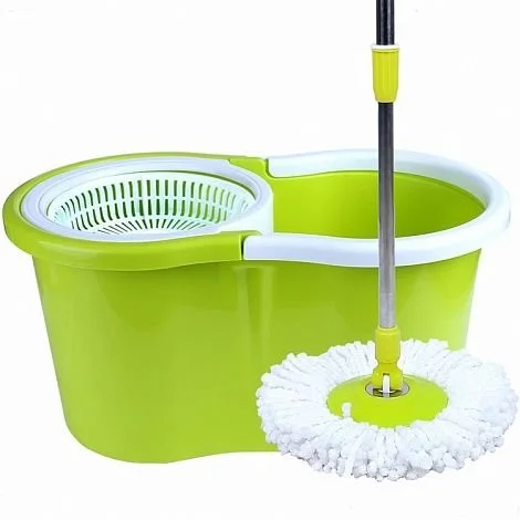 Green and white spin mop bucket with a mop leaning against it