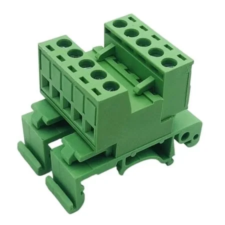 Green terminal block connector with multiple screw terminals.