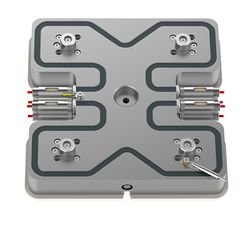 A metallic electronic component with four terminal connectors, two on each side, and a central mounting hole.