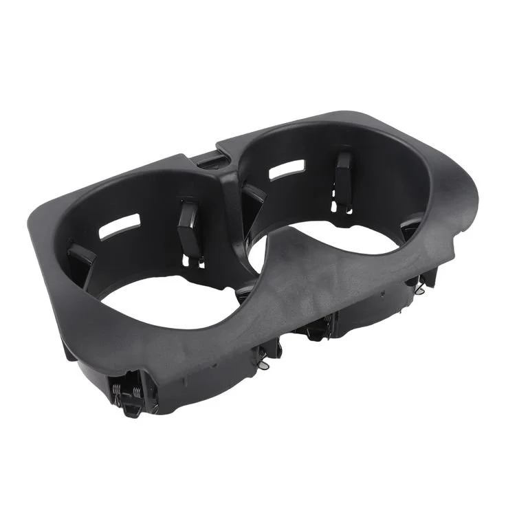 A black plastic dual cup holder for a vehicle or bike.