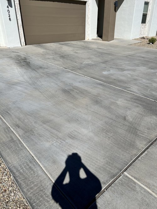 Tire marks on concrete driveway in Las Cruces NM