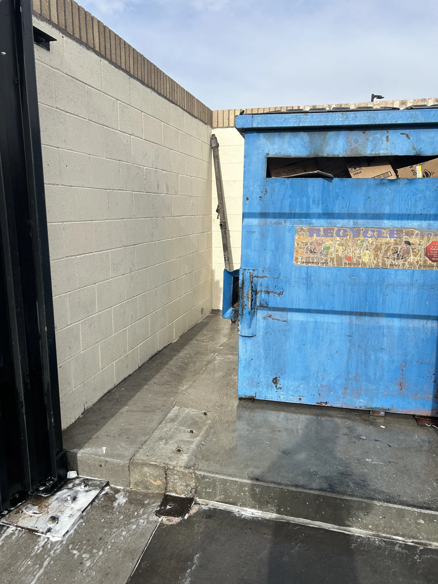 Surrounding concrete around dumpster pad