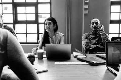 Consulting team reviewing clinical and operational strategy during a working session with Restimulate Health