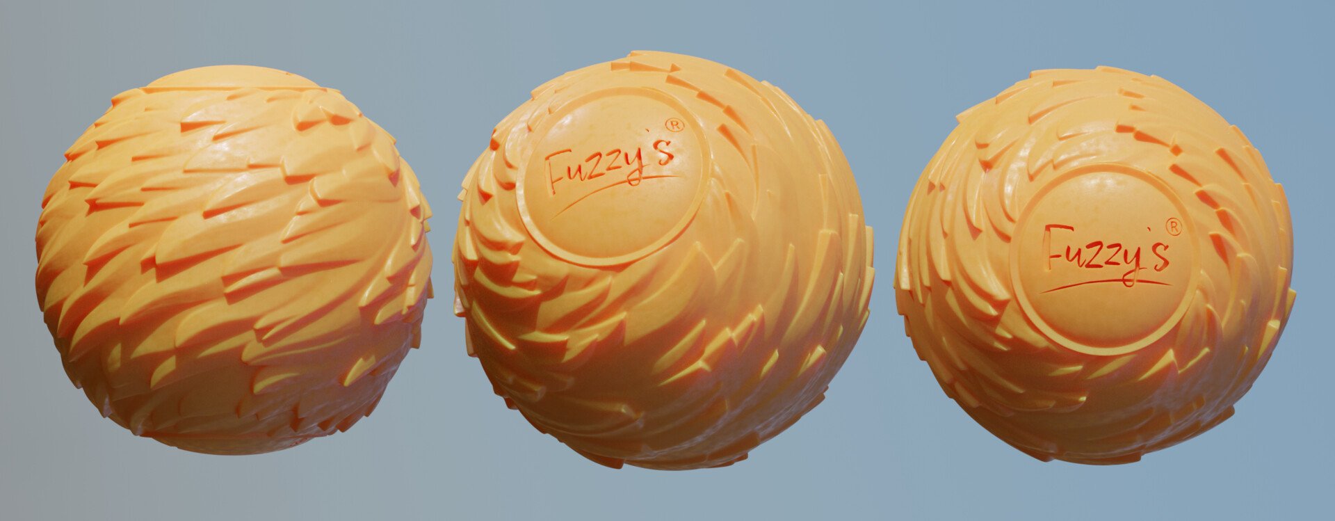 Three orange textured rubber balls with the brand name "Fuzzy's" written on the bottom of each in red ink.