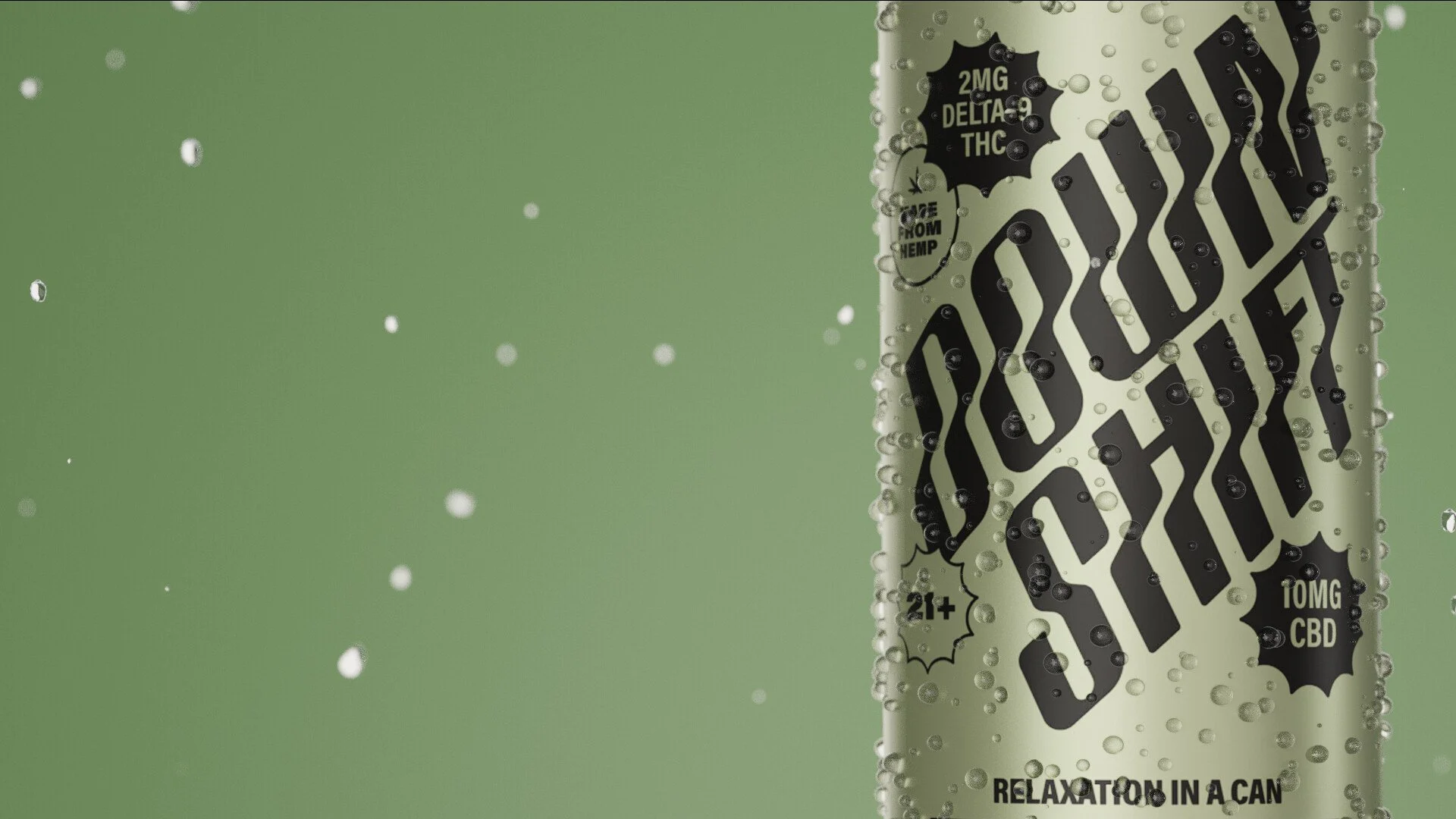 Close-up of a sparkling beverage can with black text that says 'Delta 9 THC' and 'CBD' with bubbles and droplets on the surface, set against a green background.