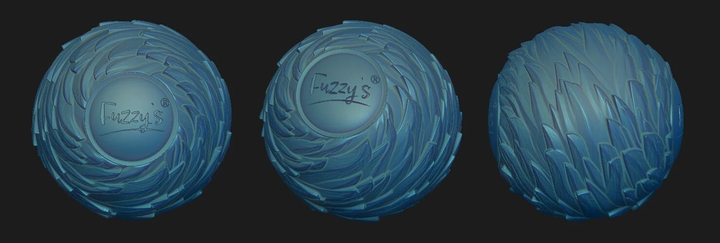 Three fuzzy blue balls with textured surfaces and the brand name 'Fuzzy's' written on the top in a circular logo, displayed against a black background.