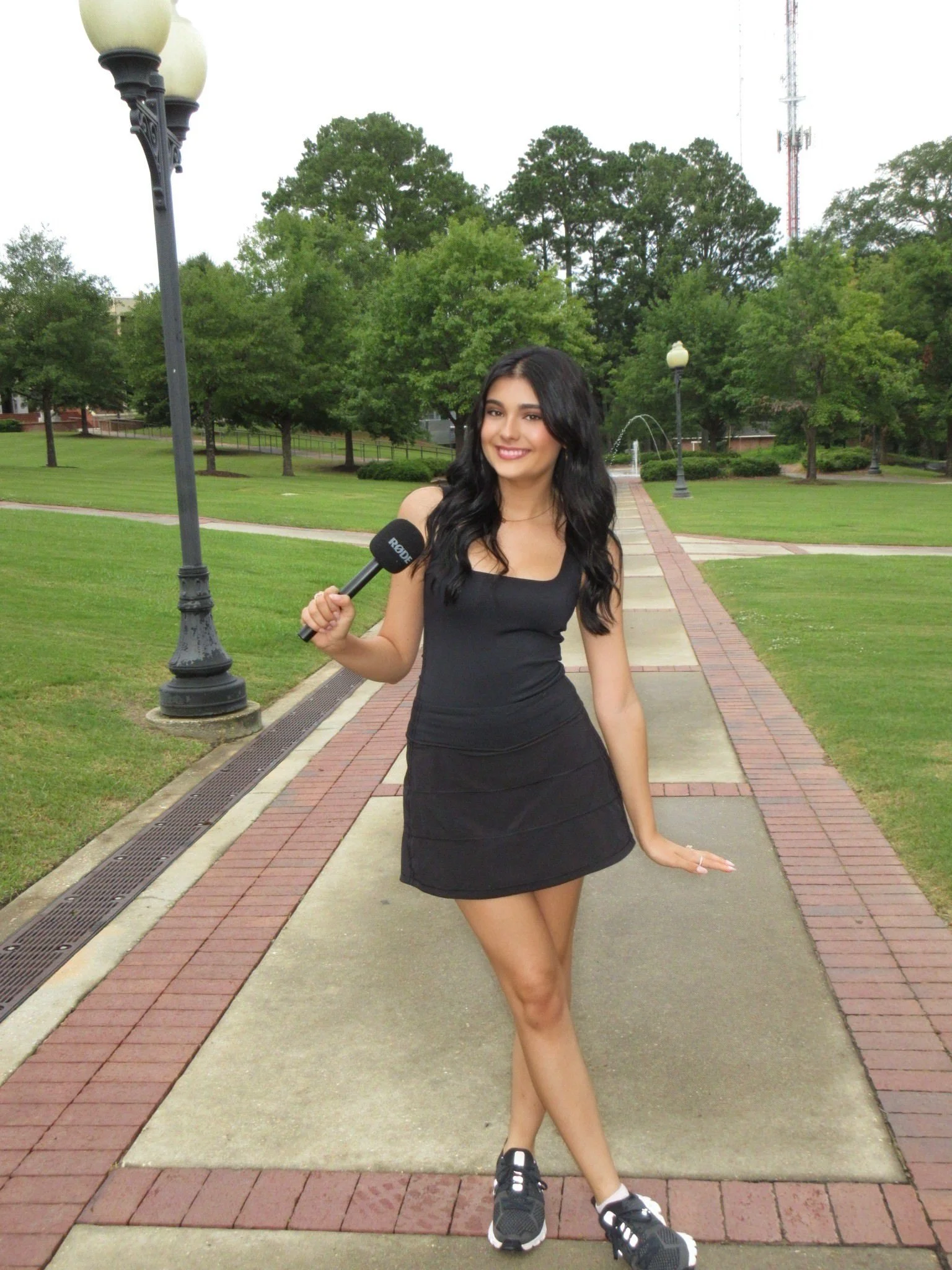 Faith Merrill standing in a park.