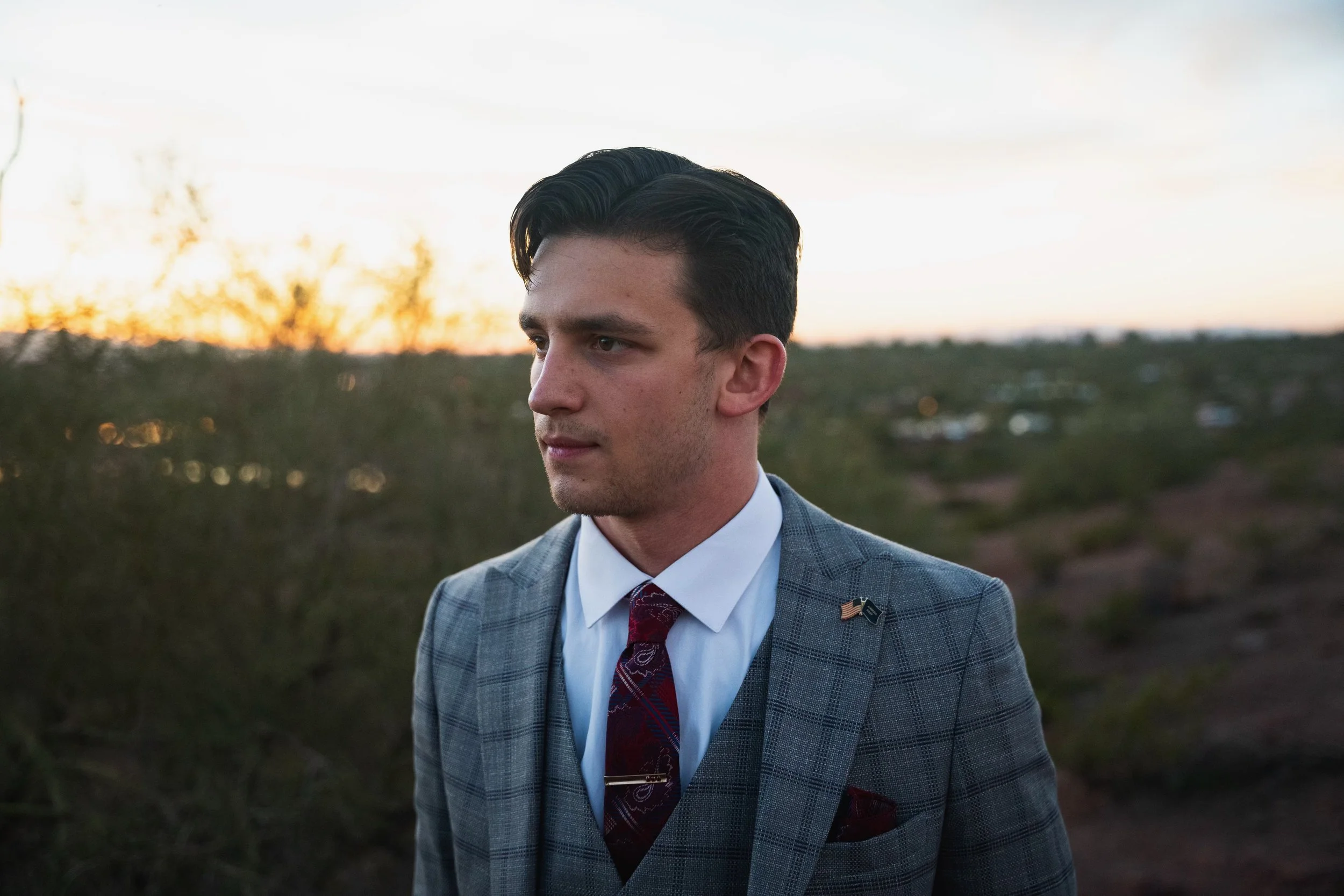 Nathan Remillard (Yankee News 1776) looks to his right with the sunset behind him.