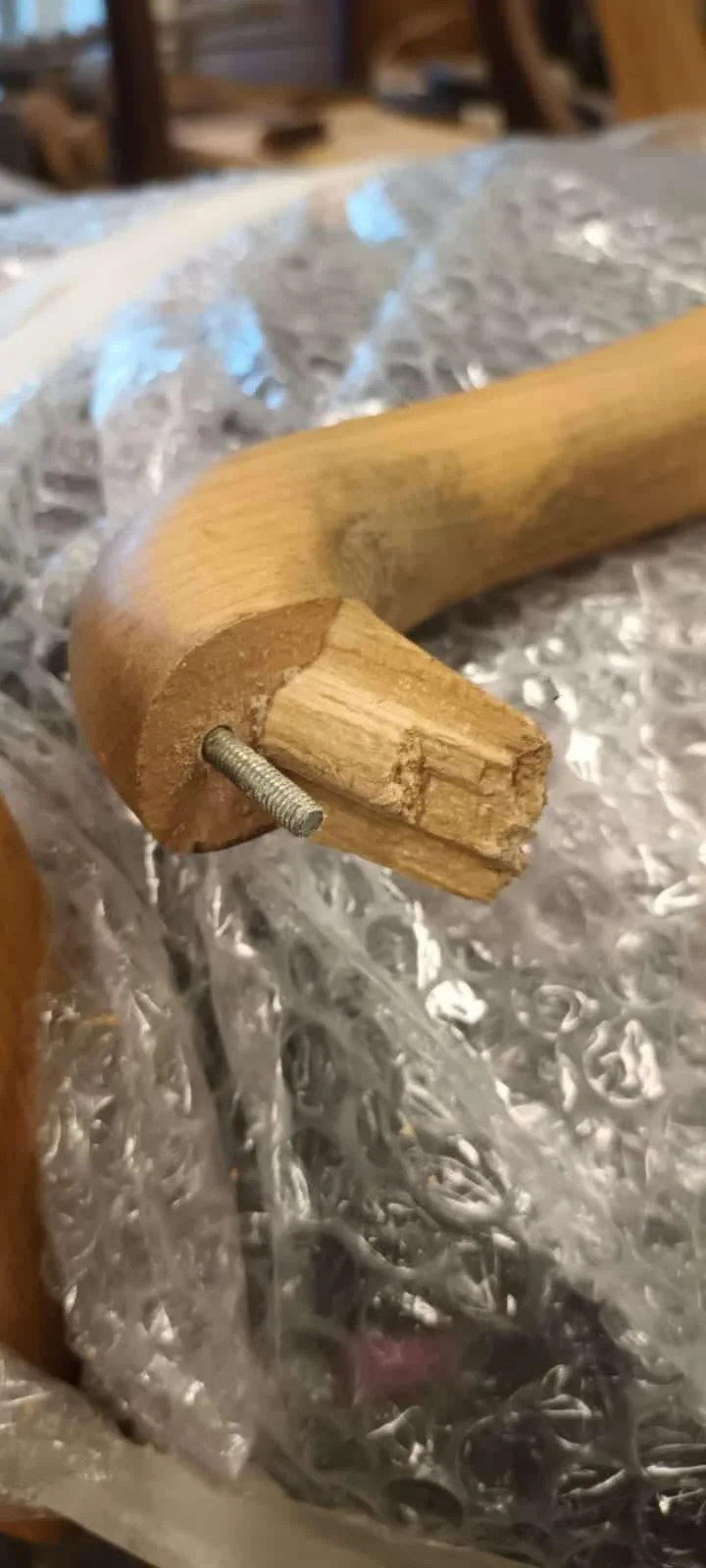 Close up of a snapped wooden chair arm being rebuilt with internal reinforcement - antique chair repair Kent