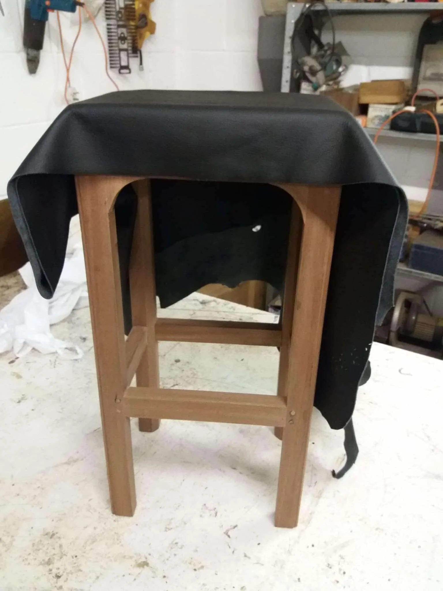 Bespoke handmade wooden bar stools with leather upholstery during construction - Foxborough Furniture