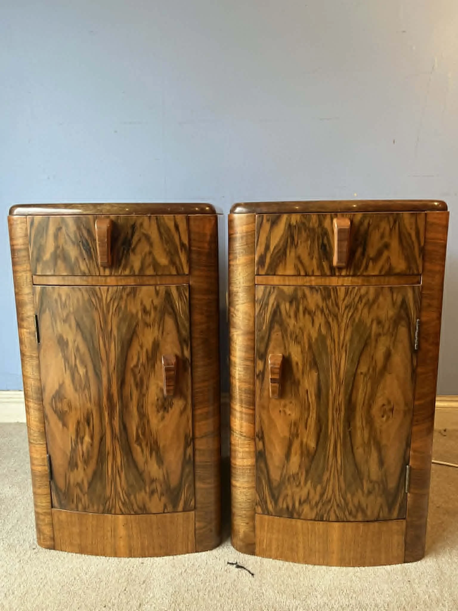 Frontal view of a matching pair of 1920s-1930s bedside cabinets after comprehensive French polishing and structural restoration in our Kent workshop.