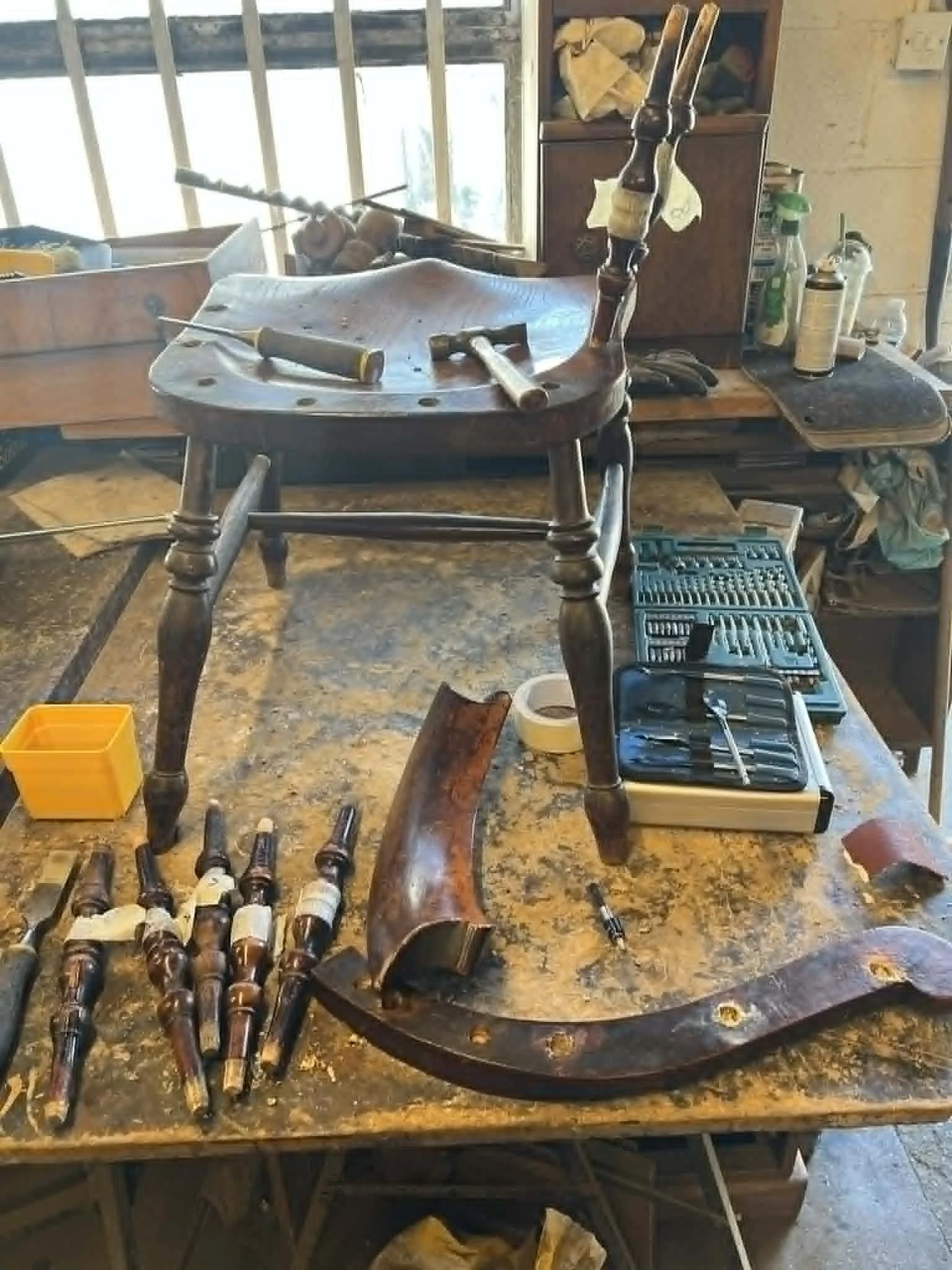 A set of antique chair components fully disassembled to remove old glue and prepare for structural joint repair in our Kent workshop.