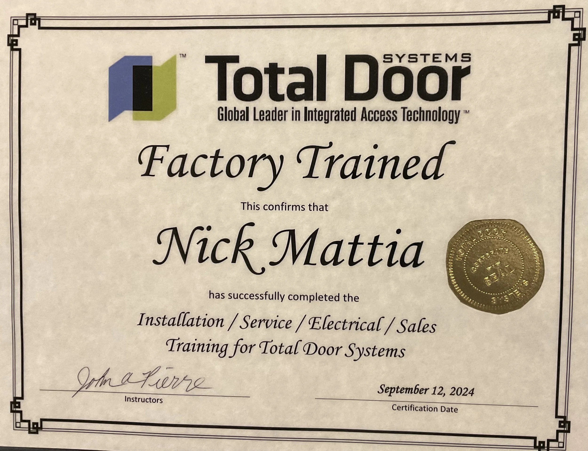 Factory trained technician certification from Total Door Systems for Nick Mattia, dated September 12, 2024, featuring a gold seal and a logo with blue, black, and green colors.