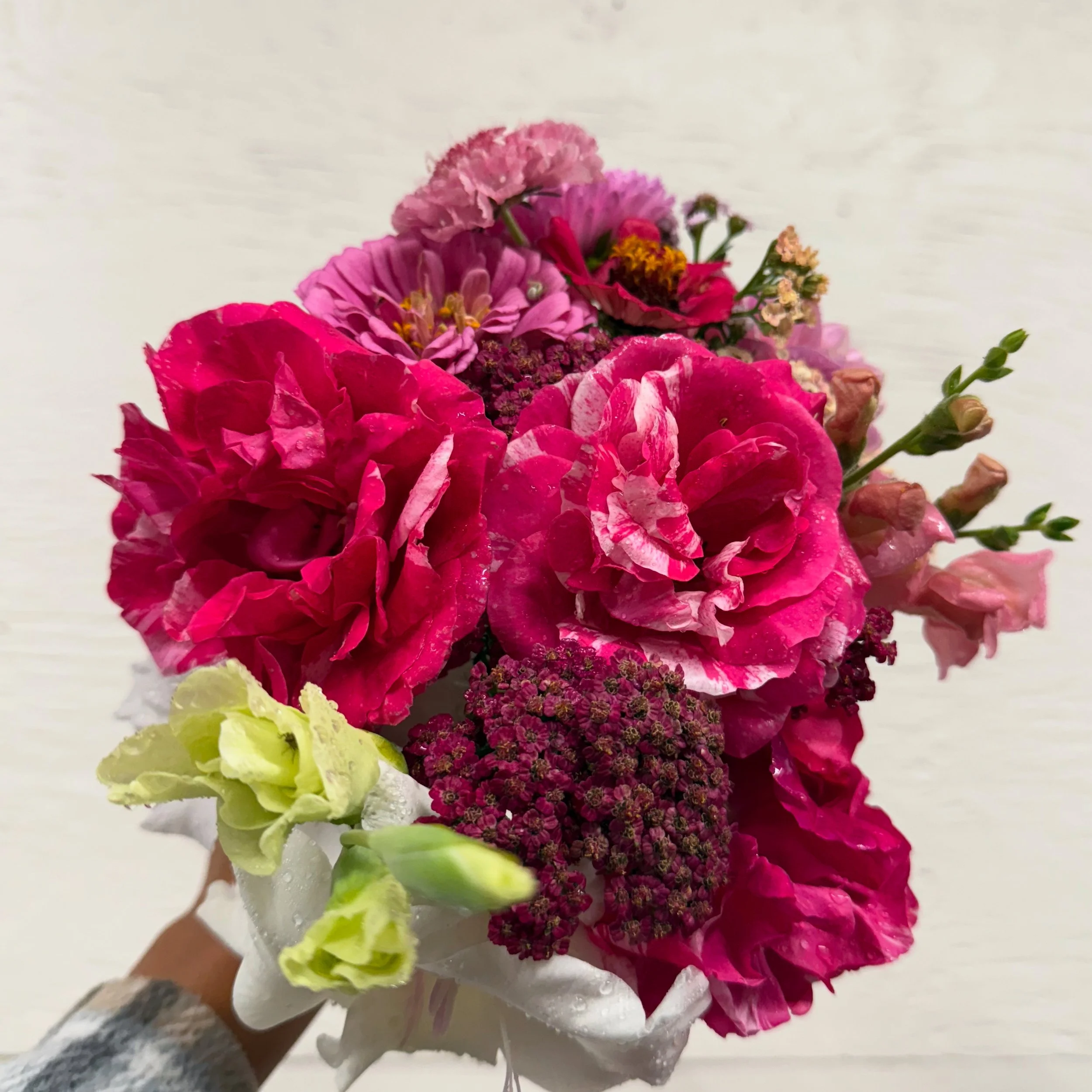 Colorful bouquet of pink, purple, yellow, and white flowers