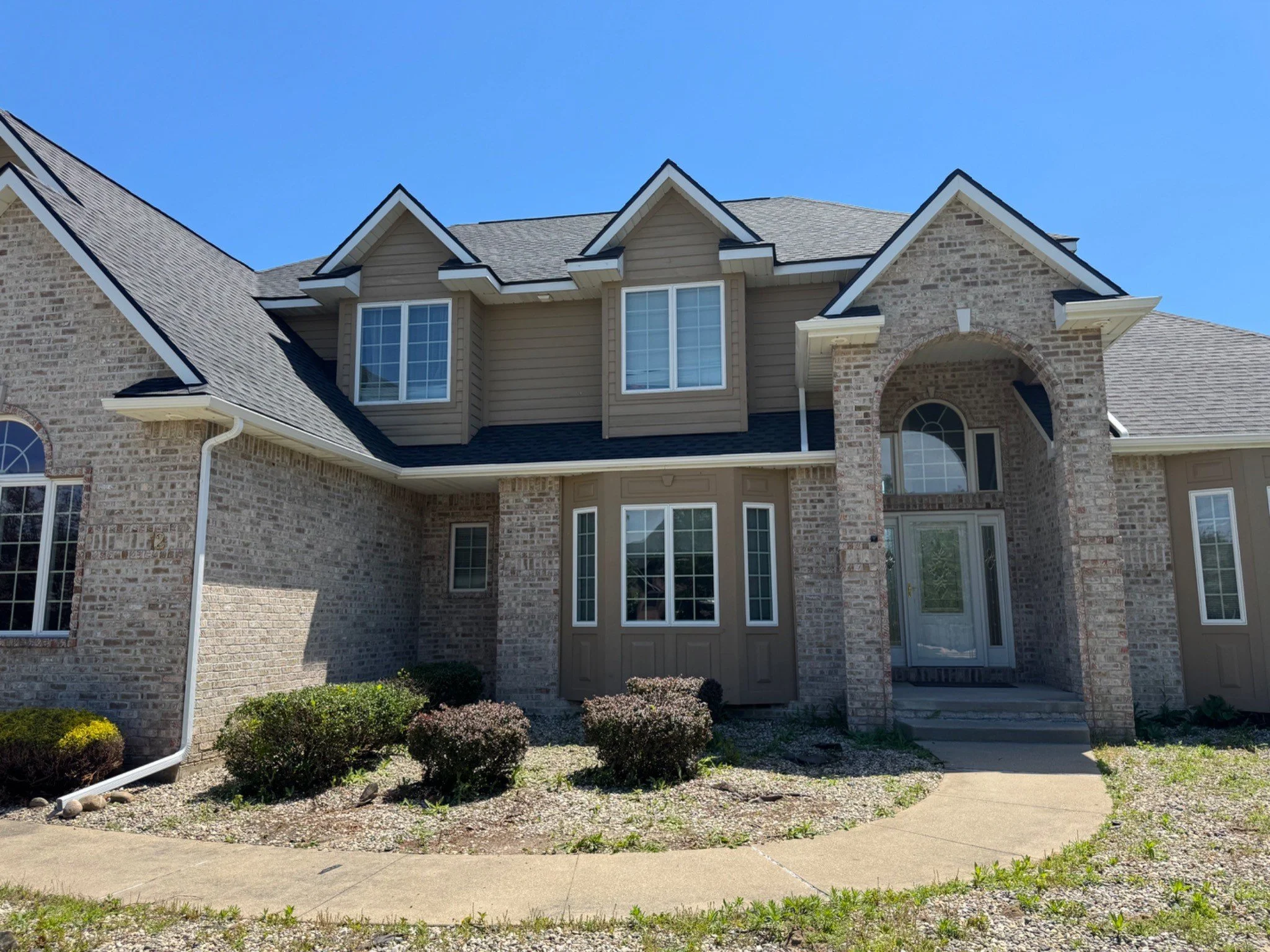 Completed gutter installation on the front of a home in Saginaw Township