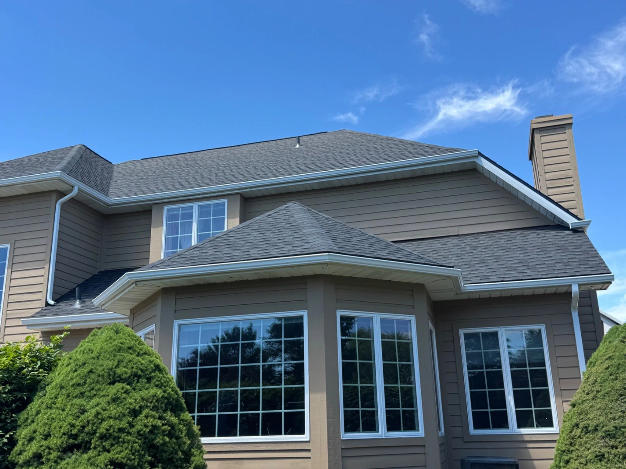 New gutters and downspouts installed on a Sawmill Subdivision home in Saginaw Township, MI