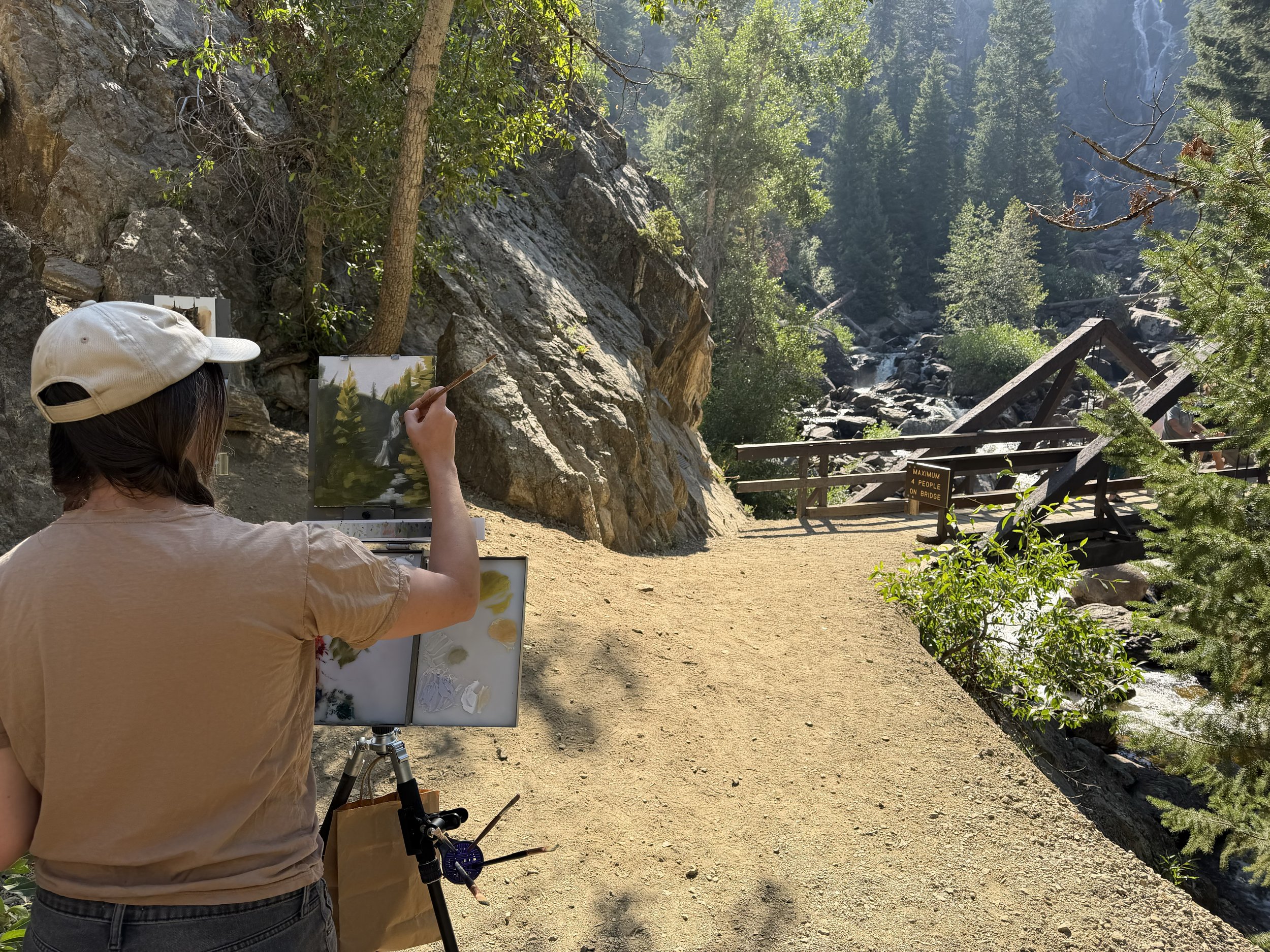Emma Friedland painting at Fish Creek Falls
