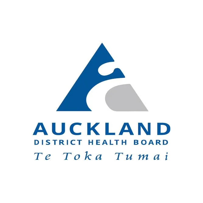 A logo for Auckland District Health Board featuring a stylized blue and gray mountain with a white shape resembling a bird or wave, and the words "Auckland District Health Board" and "Te Toka Tumai" in blue text.