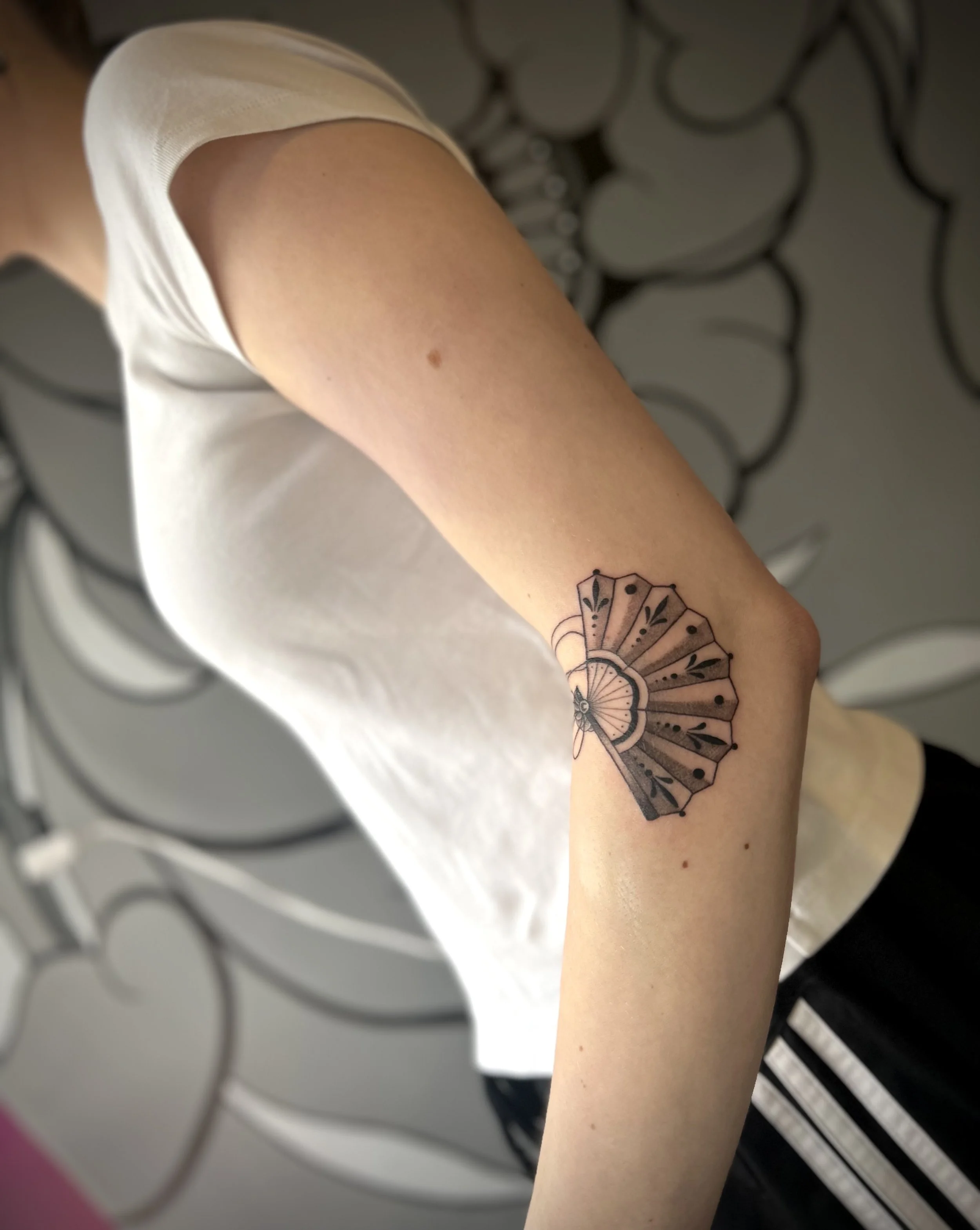 Japanese fan black and grey fine line tattoo