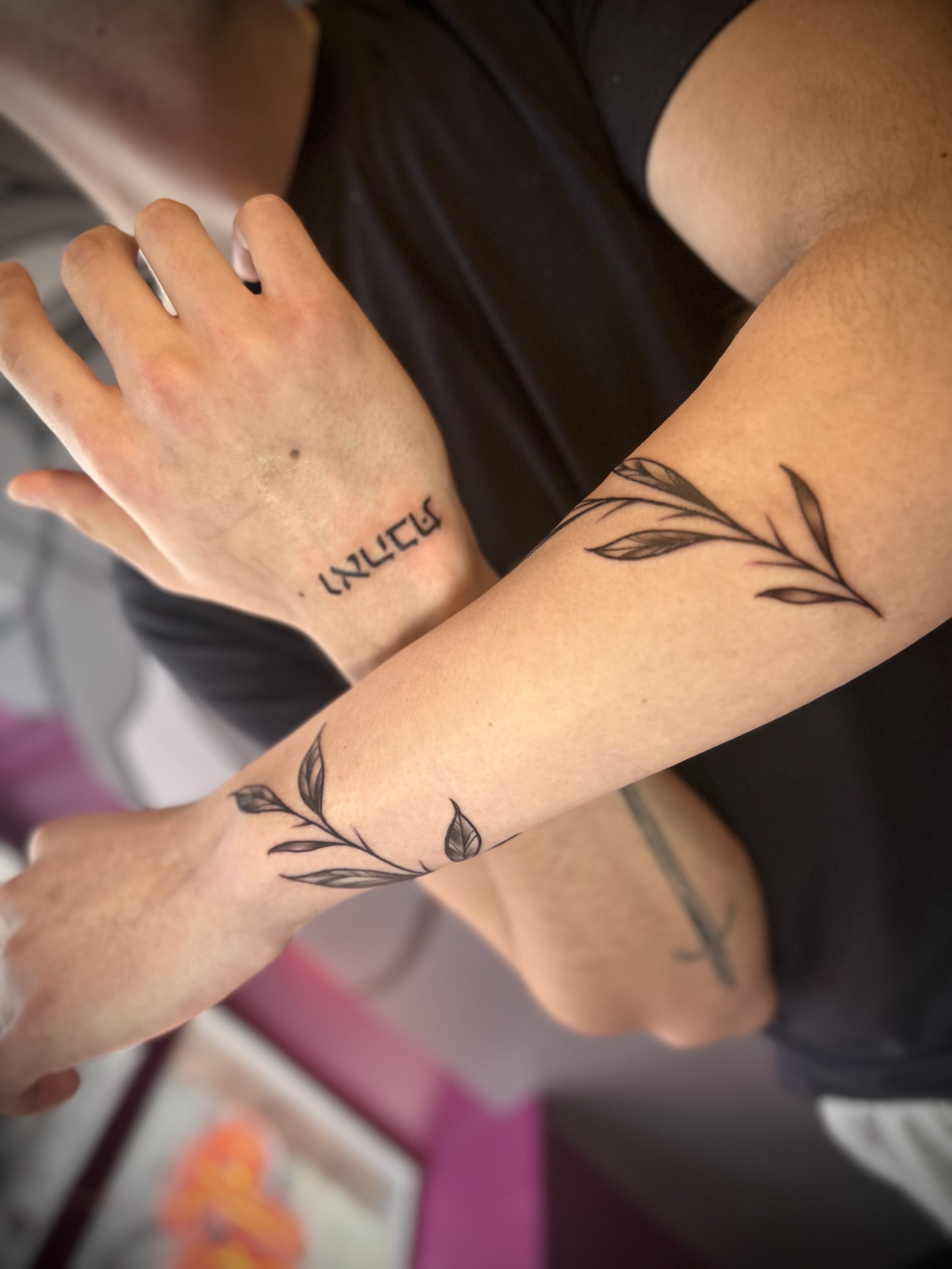 Fine line vine tattoo