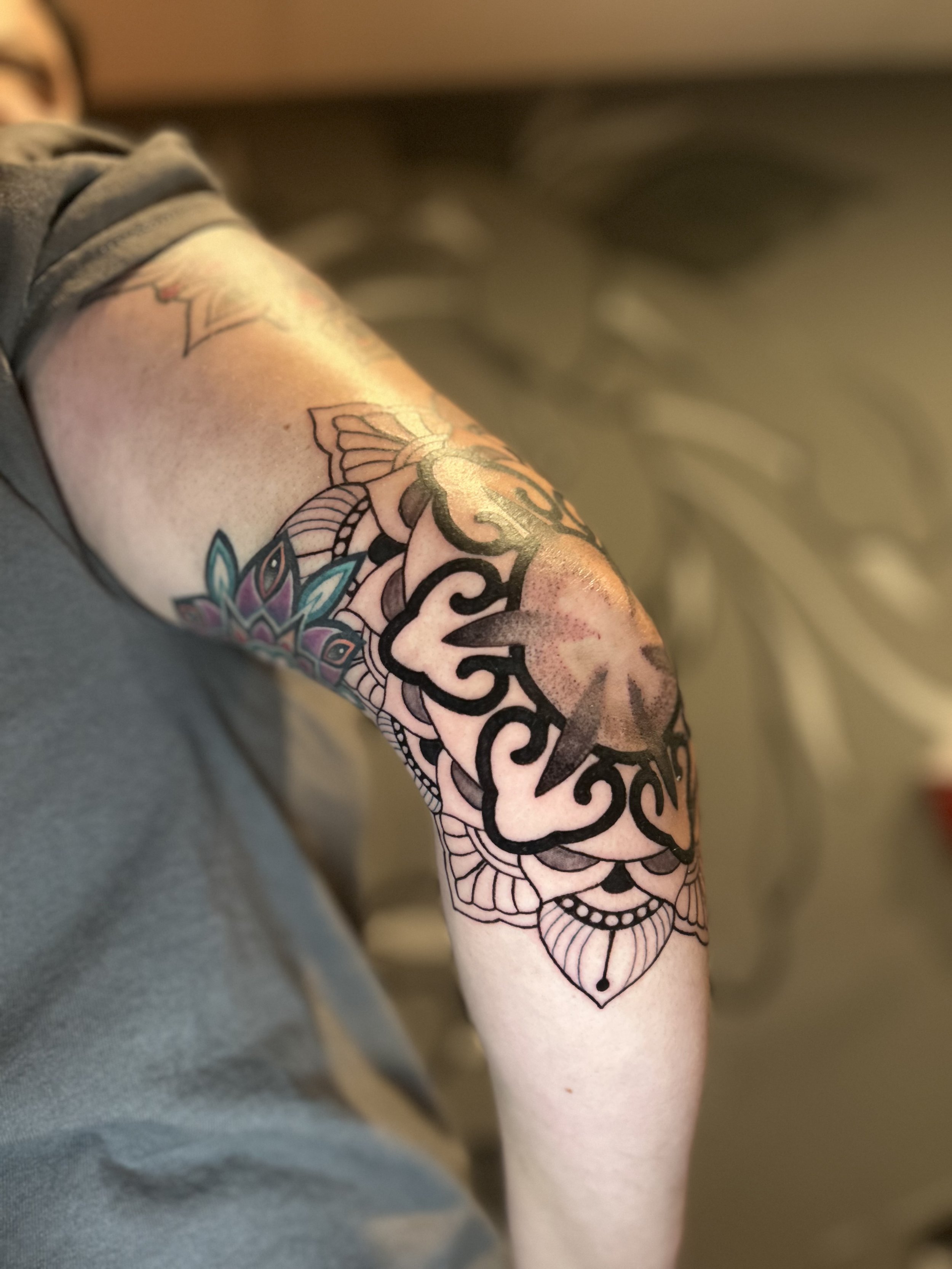Elbow mandala tattoo