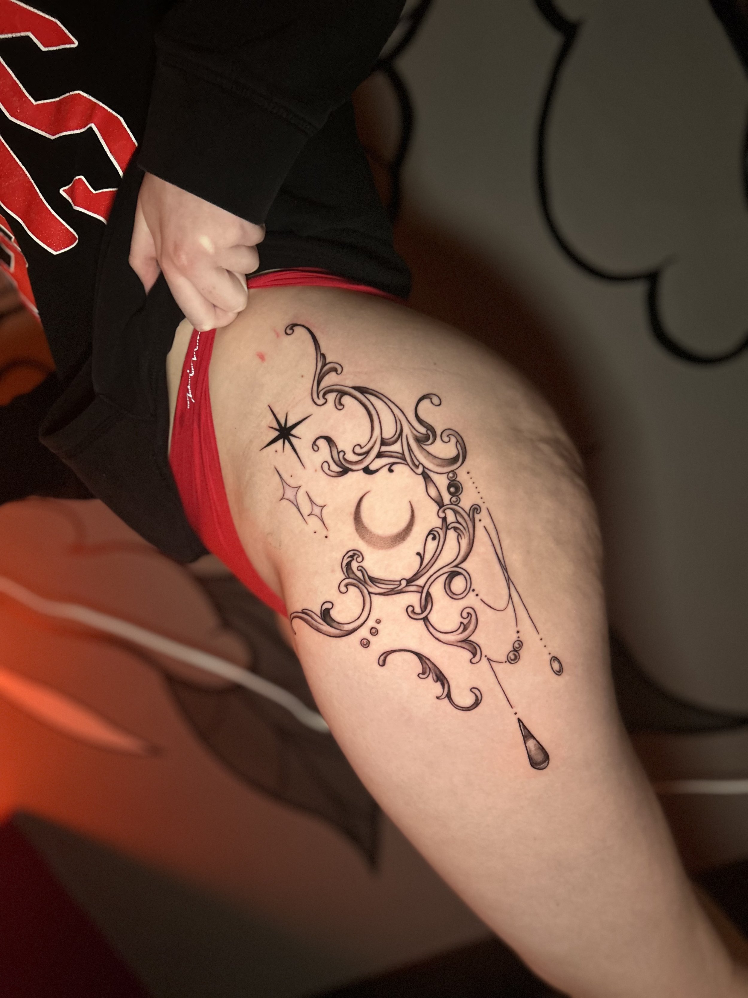 Ornamental hip tattoo
