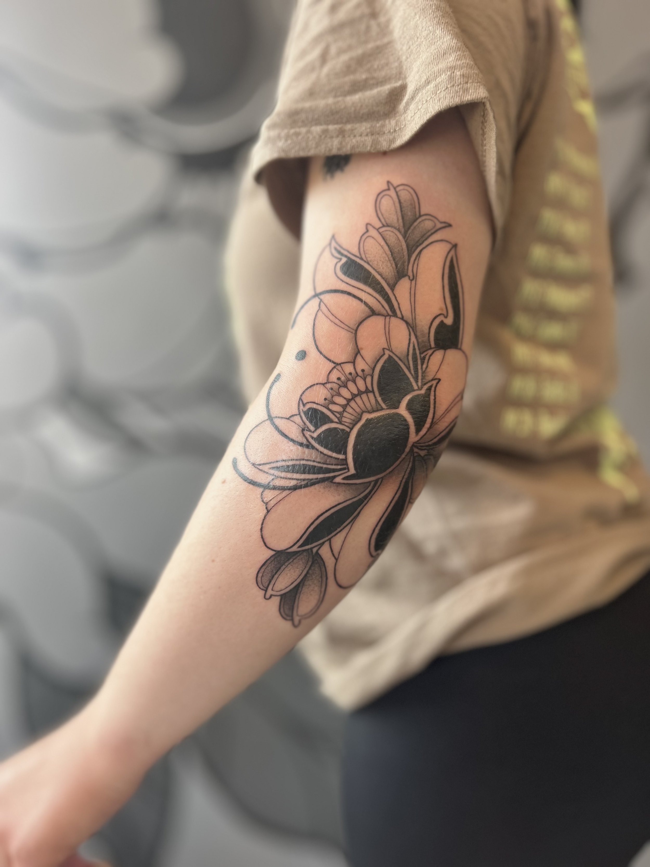 Neo traditional peony black work tattoo