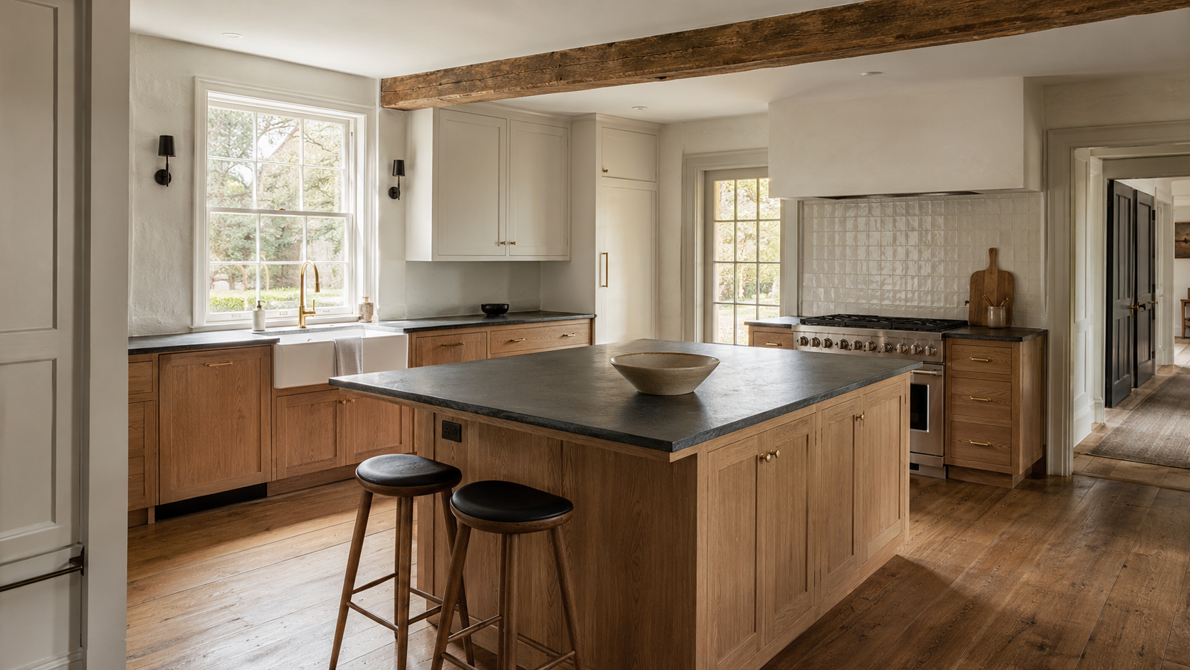 Completed Hudson Valley kitchen remodel with custom white oak cabinetry, a soapstone island, apron-front sink, exposed timber beam, and original wood floors.