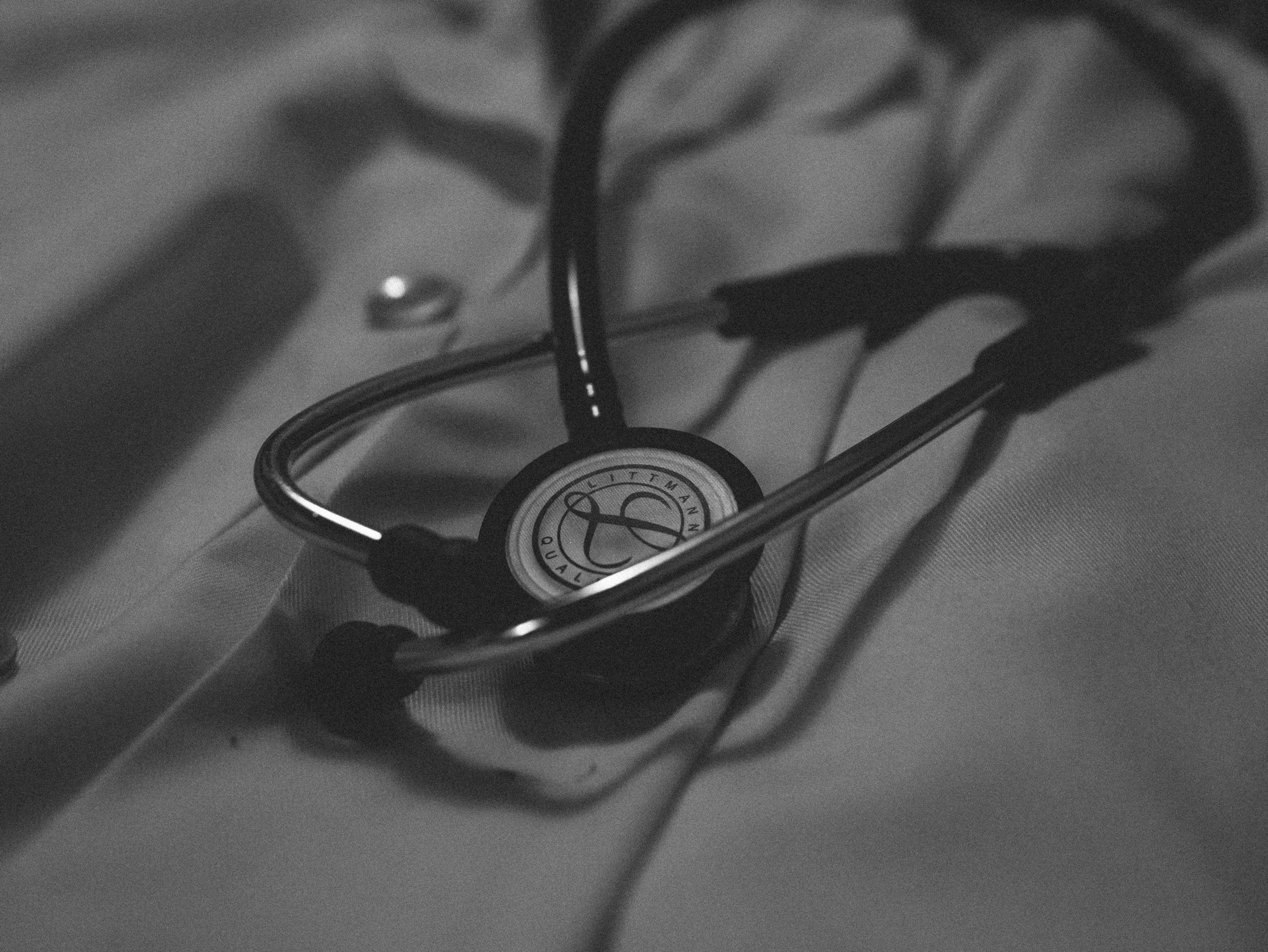 A stethoscope resting on a medical surface.